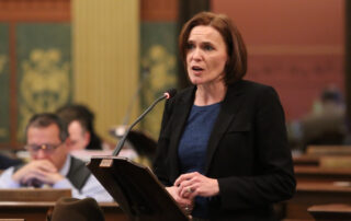 State Rep. Winnie Brinks (D-Grand Rapids) speaks on the House floor against Senate Bill 1244 at the state Capitol in Lansing on Tuesday, Dec. 18, 2018.