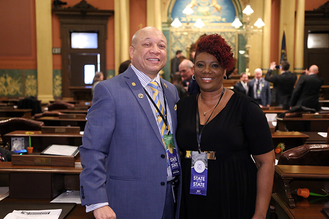 State Rep. Sheldon Neeley (D-Flint) is joined by his wife, Cynthia Neeley, for Gov. Whitmer's first State of the State address at the state Capitol in Lansing on Tuesday, Feb. 12, 2019.