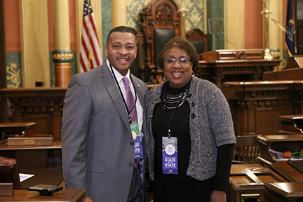 State Rep. Tyrone Carter (D-Detroit) joined by Western Wayne County NAACP President Gina Wilson-Steward for Gov. Whitmer's first State of the State address in the Capitol in Lansing on Tuesday, Feb. 12, 2019