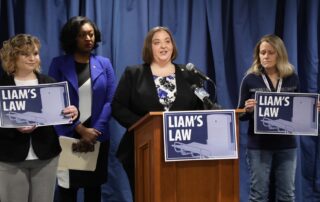 State Rep. Lori Stone (D-Warren) unveiling “Liam’s Law” with State Rep. Sarah Anthony (D-Lansing); Jessica Gomez of Saginaw, Liam’s mother (Left); and Amy Maes of Disability Network Oakland and Macomb (Right) at a press conference in Lansing on Thursday, Jan. 23, 2020 (Photo courtesy of House Democrats).