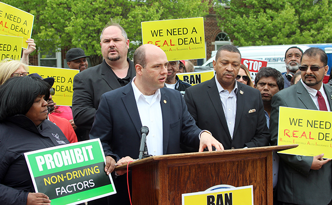 State Rep. John Cherry (D-Flint) speaks at an auto insurance reform press conference at Hamtramck City Hall Monday, May 20, 2019.