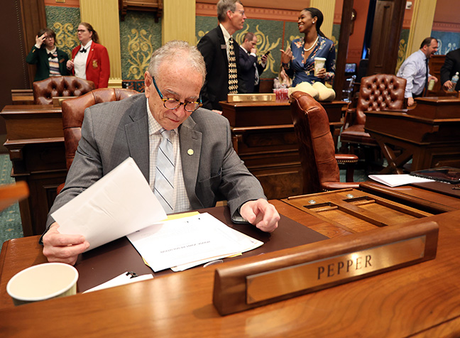 Newly-elected state Rep. Jeffrey Pepper (D-Dearborn) at his desk on his first day of House session on May 10, 2022.