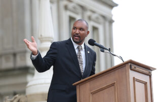 Rep. Jimmie Wilson Jr. addressing the crowd at the 'Good Time' Credits to Incarcerated Individuals press conference on the Capitol steps.