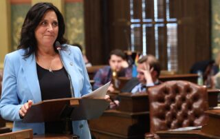 State Rep. Angela Witwer (Delta Township), chair of the House Appropriations Committee, speaks in support of the fiscal year 2023-24 budget at the Capitol on May 10, 2023.