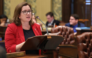 State Rep. Natalie Price (D-Berkley) speaks on the House floor during session at the state Capitol in Lansing.