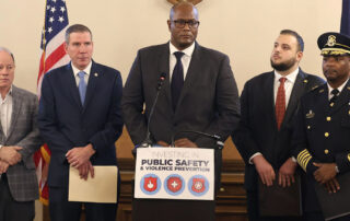 Speaker of the House Joe Tate, state Reps. Farhat and Shannon, Mayor Duggan and Police Chief White at the Michigan Capitol on Wednesday, May 24, 2023