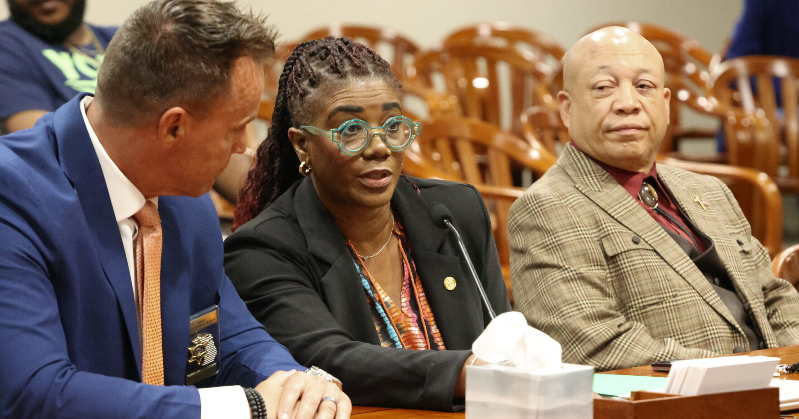 Michigan state representatives Cynthia Neeley in committee sitting by mayor Neeley and unknown stakeholder.