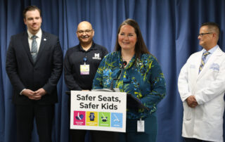 State Rep. Carrie A. Rheingans (D-Ann Arbor) stands at the podium during her and state Rep. John Fitzgerald’s (D-Wyoming) Safer Seats, Safer Kids press conference on May 4, 2023, at the House Office Building in Lansing.