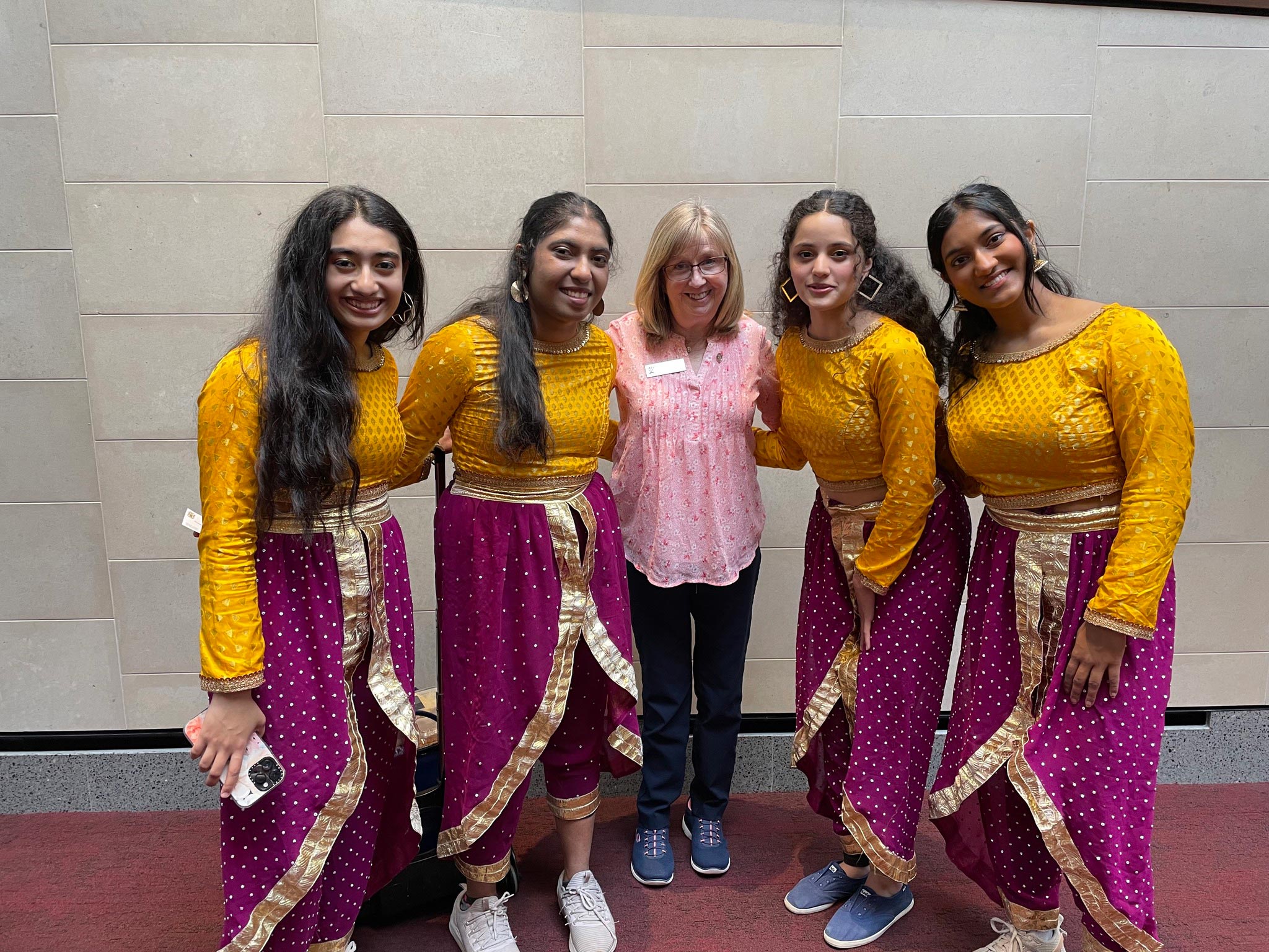 Rep MacDonell with dancers from India Day at the Capitol