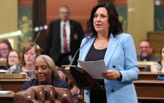 State Rep. Angela Witwer (Delta Township), chair of the House Appropriations Committee, speaks in support of the fiscal year 2023-24 budget at the Michigan Capitol on May 10, 2023.