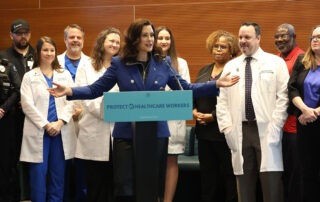 Gov. Gretchen Whitmer speaks at the signing of House Bills 4520-4521 on Dec. 6, 2023 at Sparrow Hospital in Lansing.