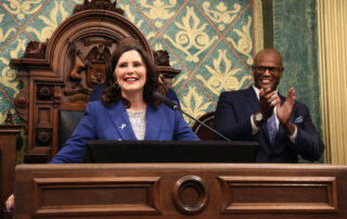 Speaker Joe Tate (D-Detroit) claps during Gov. Whitmer's State of the State Address.