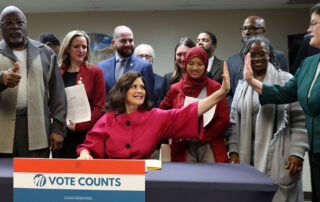 Gov. Whitmer signs election bills into law, Nov. 30, 2023, at the ACLU in Detroit.