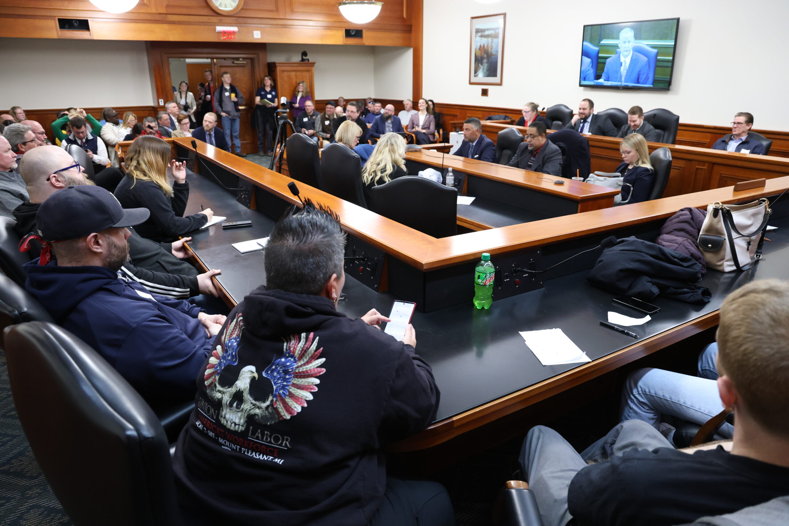 Members of the public listen to testimony of the House Labor Committee on March 8, 2023, in the House Office Building in Lansing.