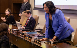 House Appropriations Chair state Rep. Angela Witwer (Delta Township) greets Gov. Gretchen Whitmer and Lt. Gov. Garlin Gilchrist at a joint meeting of the House and Senate Appropriations committees on Feb. 7 at the Michigan Capitol.