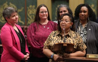 State Rep. Kimberly Edwards (D-Eastpointe), front right, speaks on her resolution, supported by, from left, state Reps. Betsy Coffia (D-Traverse City), Carrie Rheingans (D-Ann Arbor), Felicia Brabec (D-Ann Arbor) and Stephanie A. Young (D-Detroit) on Tuesday, March 5, 2024, at the Michigan Capitol in Lansing.