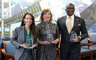 From left, state Reps. Christine Morse (D-Texas Township), Julie M. Rogers (D-Kalamazoo) and Amos O’Neal (D-Saginaw), display their awards in the Mackinac Room in the House Office Building in Lansing on April 10.