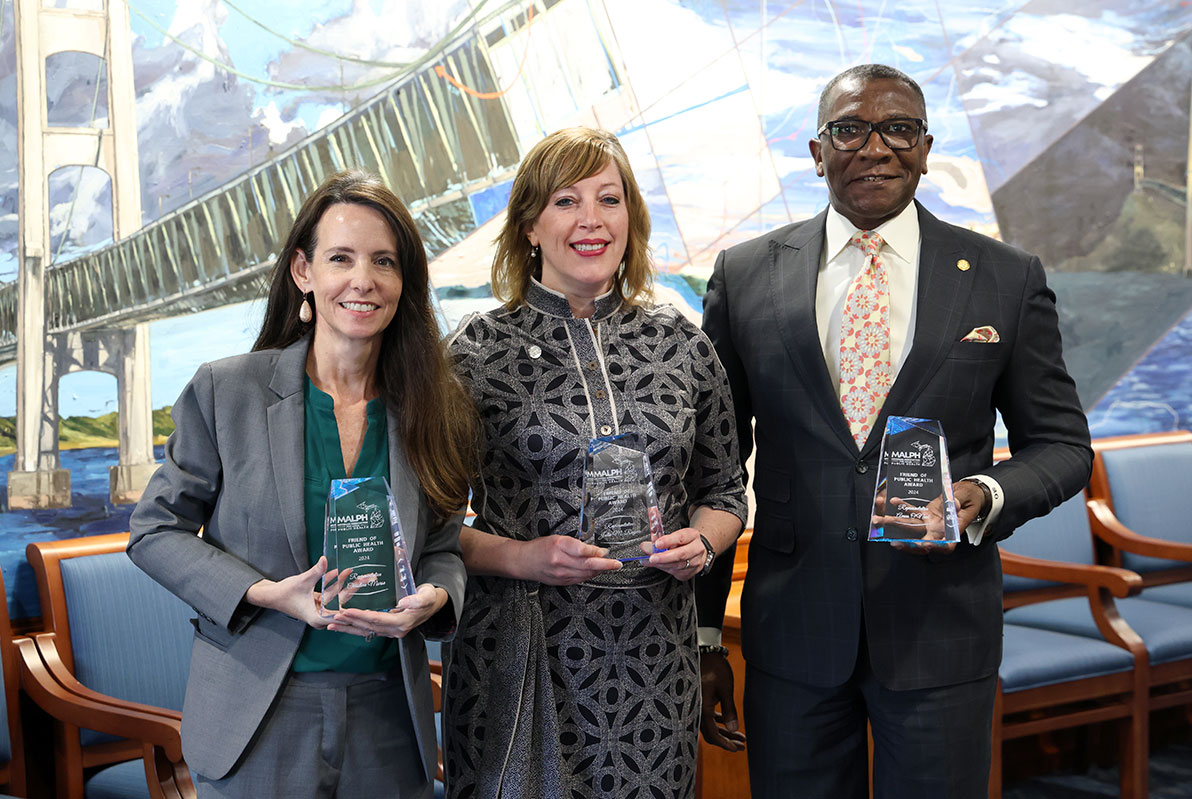 From left, state Reps. Christine Morse (D-Texas Township), Julie M. Rogers (D-Kalamazoo) and Amos O’Neal (D-Saginaw), display their awards in the Mackinac Room in the House Office Building in Lansing on April 10.
