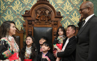 State Rep. Mai Xiong (D-Warren) stands with family as she is sworn into the Michigan House of Representatives on April 30, 2024, on the House Floor of the Capitol in Lansing.