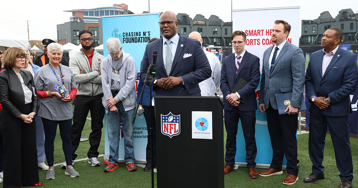 Speaker of the House Joe Tate (D-Detroit) speaks to the crowd about the recently signed AED legislation at the NFL Draft in Detroit, April 27, 2024.