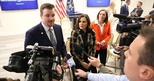 State Rep. John Fitzgerald (D-Wyoming) speaks to reporters about the passage of HB 5048 alongside Gov. Gretchen Whitmer and Senate Majority Leader Winnie Brinks (D-Grand Rapids) on April 15 at The Right Place in Grand Rapids.