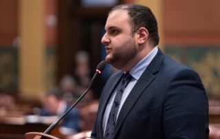 Rep. Farhat stands at podium on House floor supporting Arab American History Month resolution.