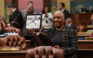 State Rep. Scott holds a photo of her great uncle, a Negro Leagues player.