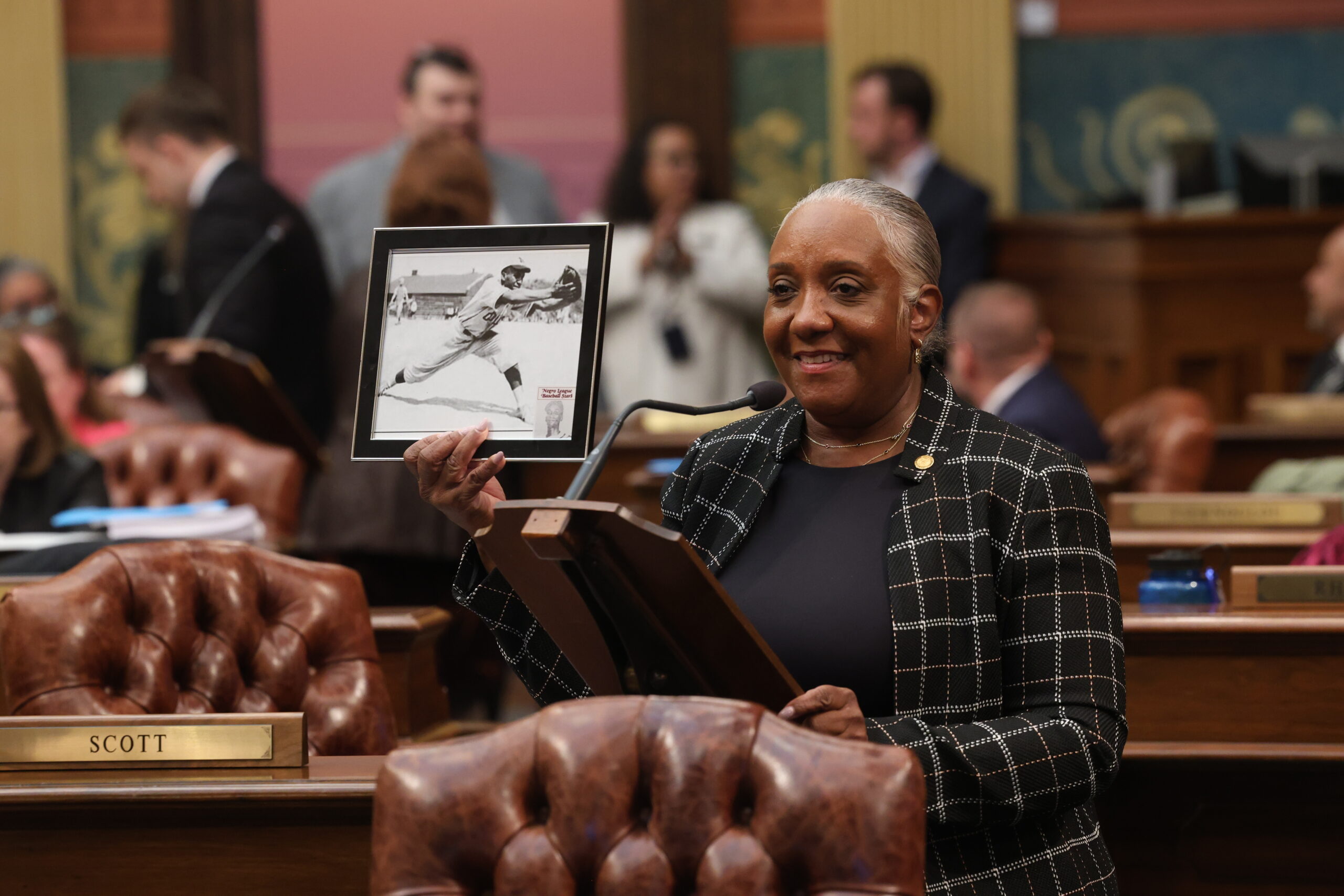 State Rep. Scott holds a photo of her great uncle, a Negro Leagues player.