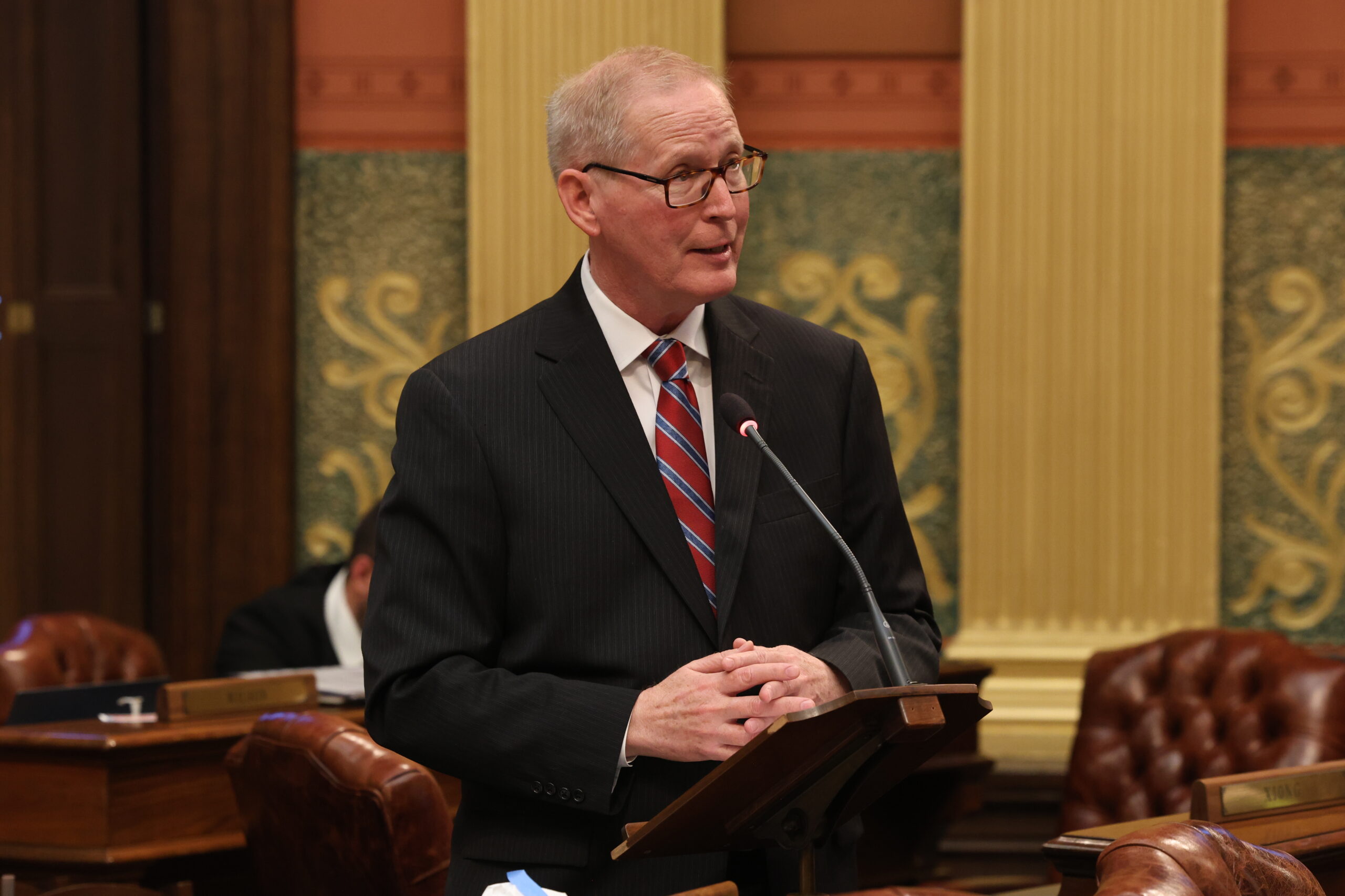 Michigan state Representative Jim Haadsma speaks in support of a budget amendment on the floor of the Michigan House of Representatives.
