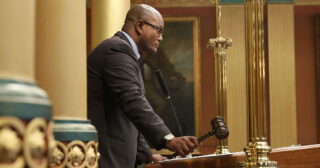 Speaker of the House Joe Tate (D-Detroit) gavels in session at the Michigan Capitol.