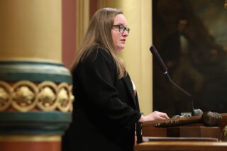 Michigan state Representative Kelly Breen speaks on the House Floor in the Michigan Capitol Building.