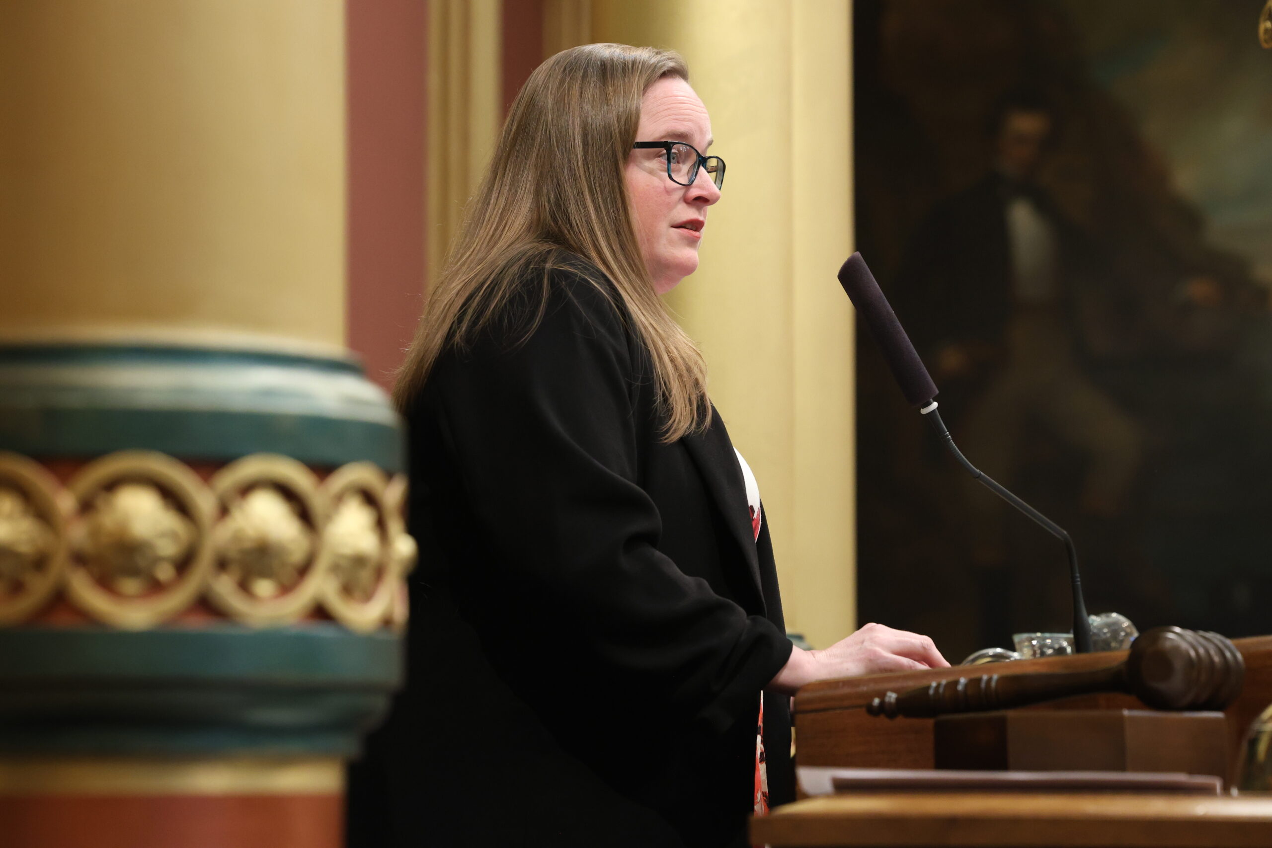 Michigan state Representative Kelly Breen speaks on the House Floor in the Michigan Capitol Building.
