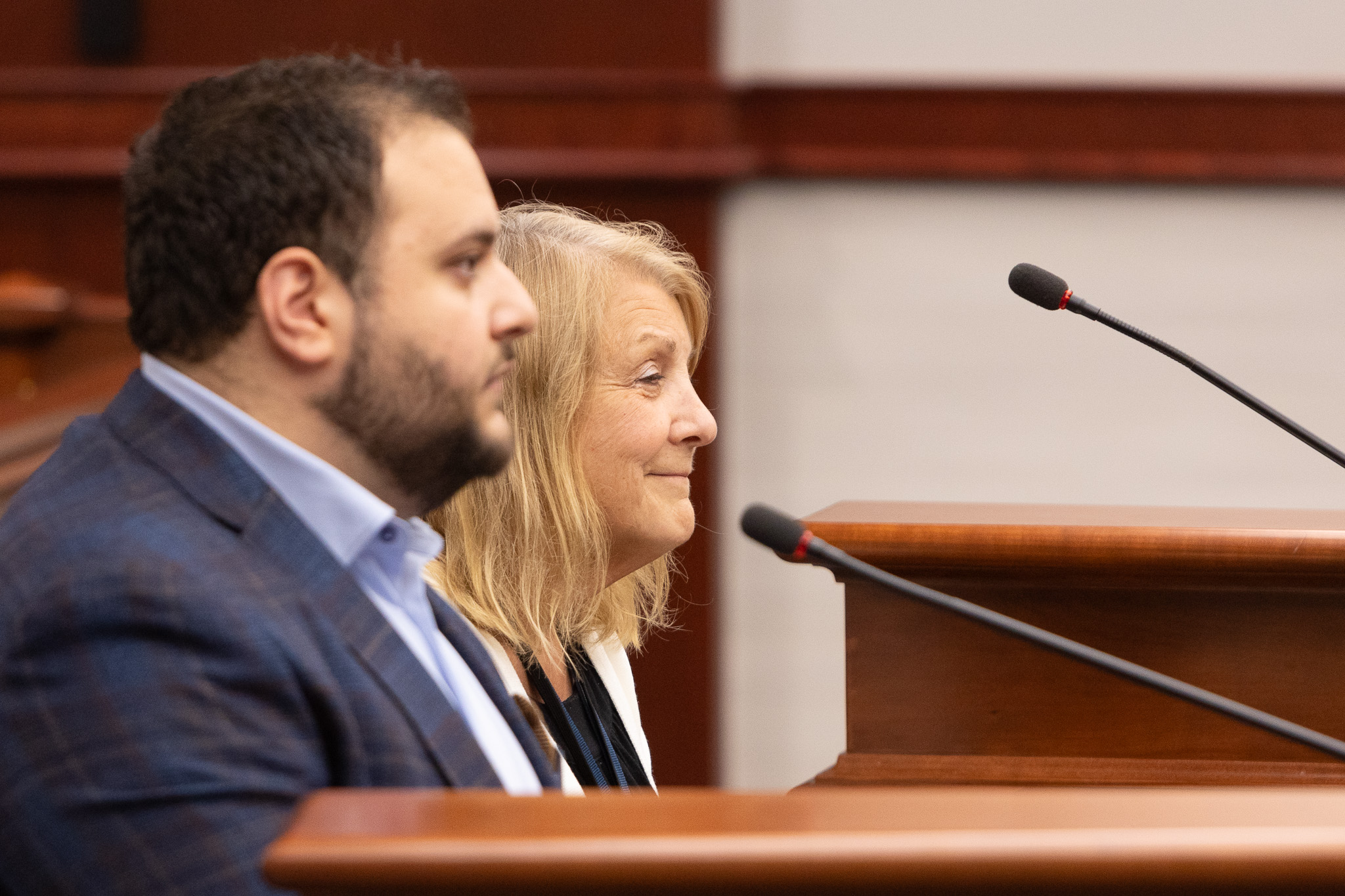 State Reps. Alabas Farhat (D-Dearborn) and Denise Mentzer (D-Mount Clemens) sit and testify in a Senate committee on Thursday, June 20, 2024, at the Binsfeld Office Building in Lansing.