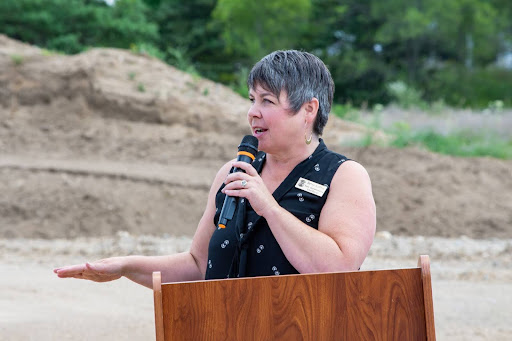 State Rep. Betsy Coffia speaking at the groundbreaking event for the new Benzie County emergency communications tower.