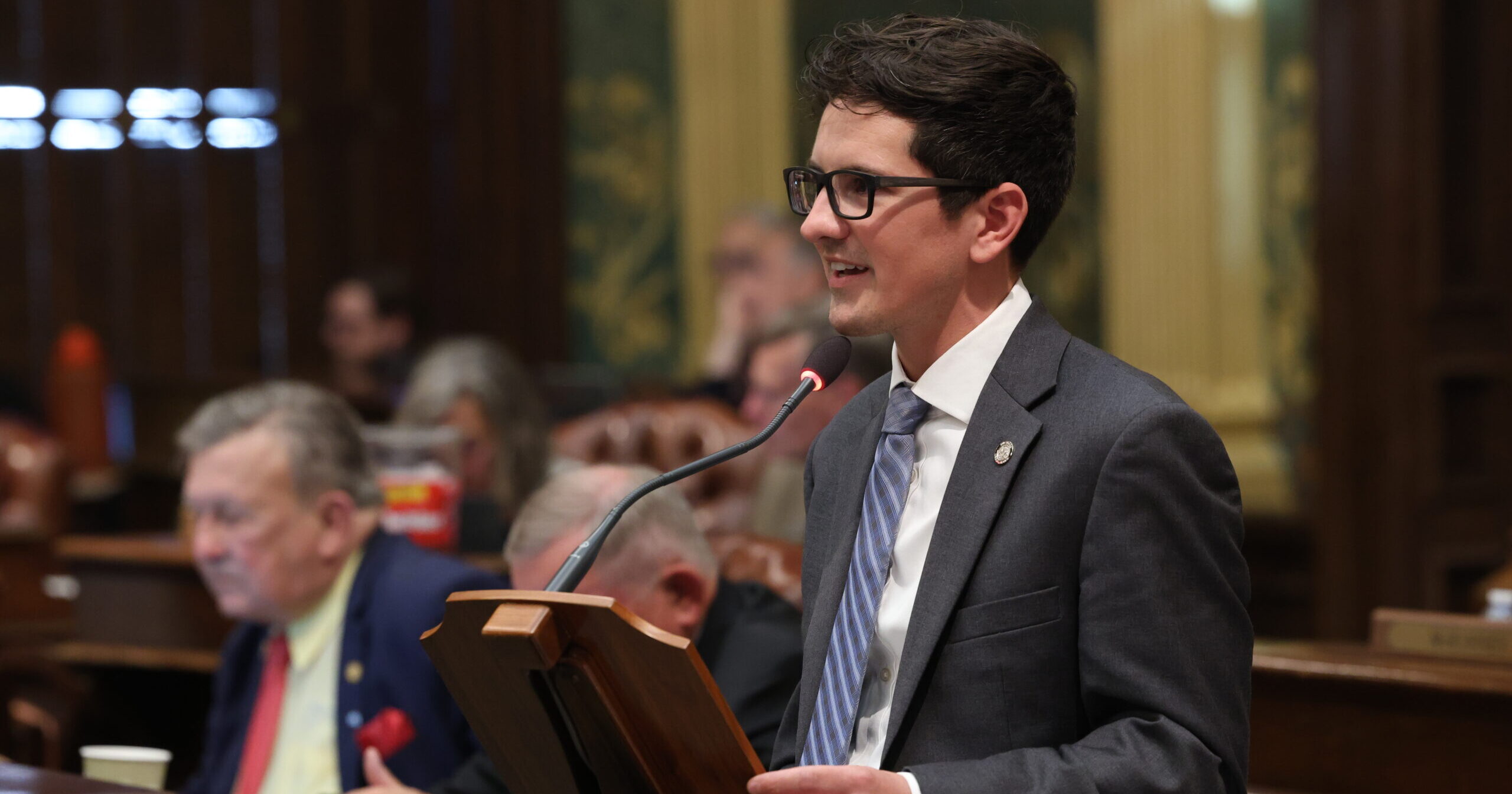 Michigan State Rep. Jason Morgan speaking on the House Floor at the state capitol in Lansing.