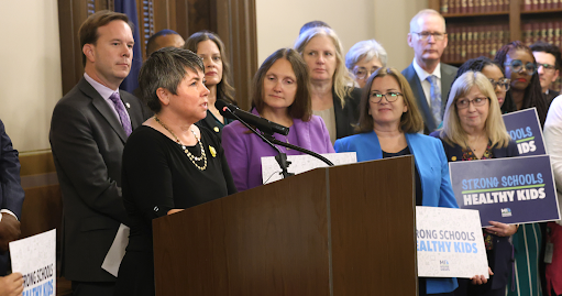 Michigan state Representative Betsy Coffia speaking at a press conference.