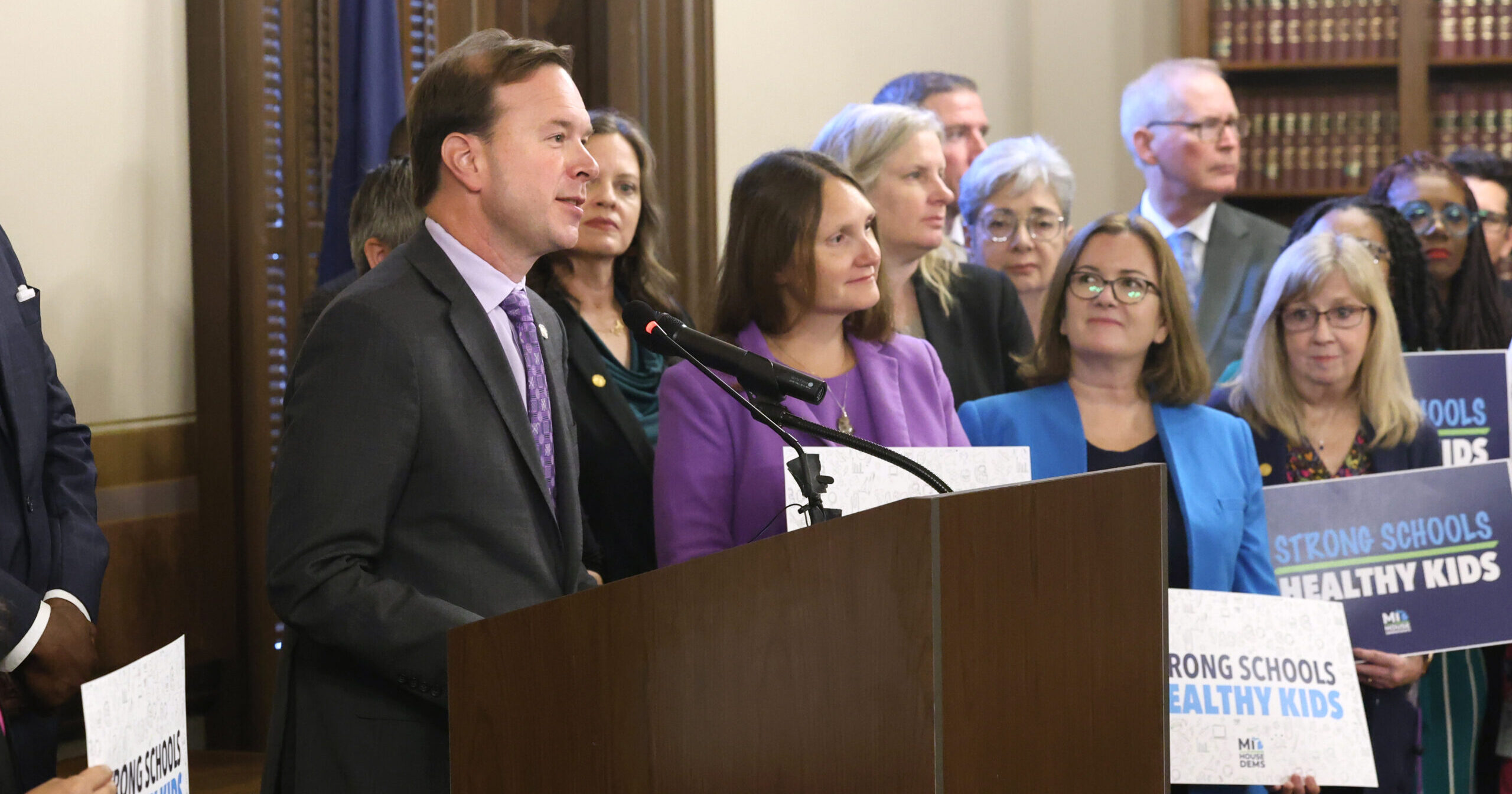 Michigan state Representative Matt Koleszar speaks at an education press conference in the Michigan State Capitol Building.