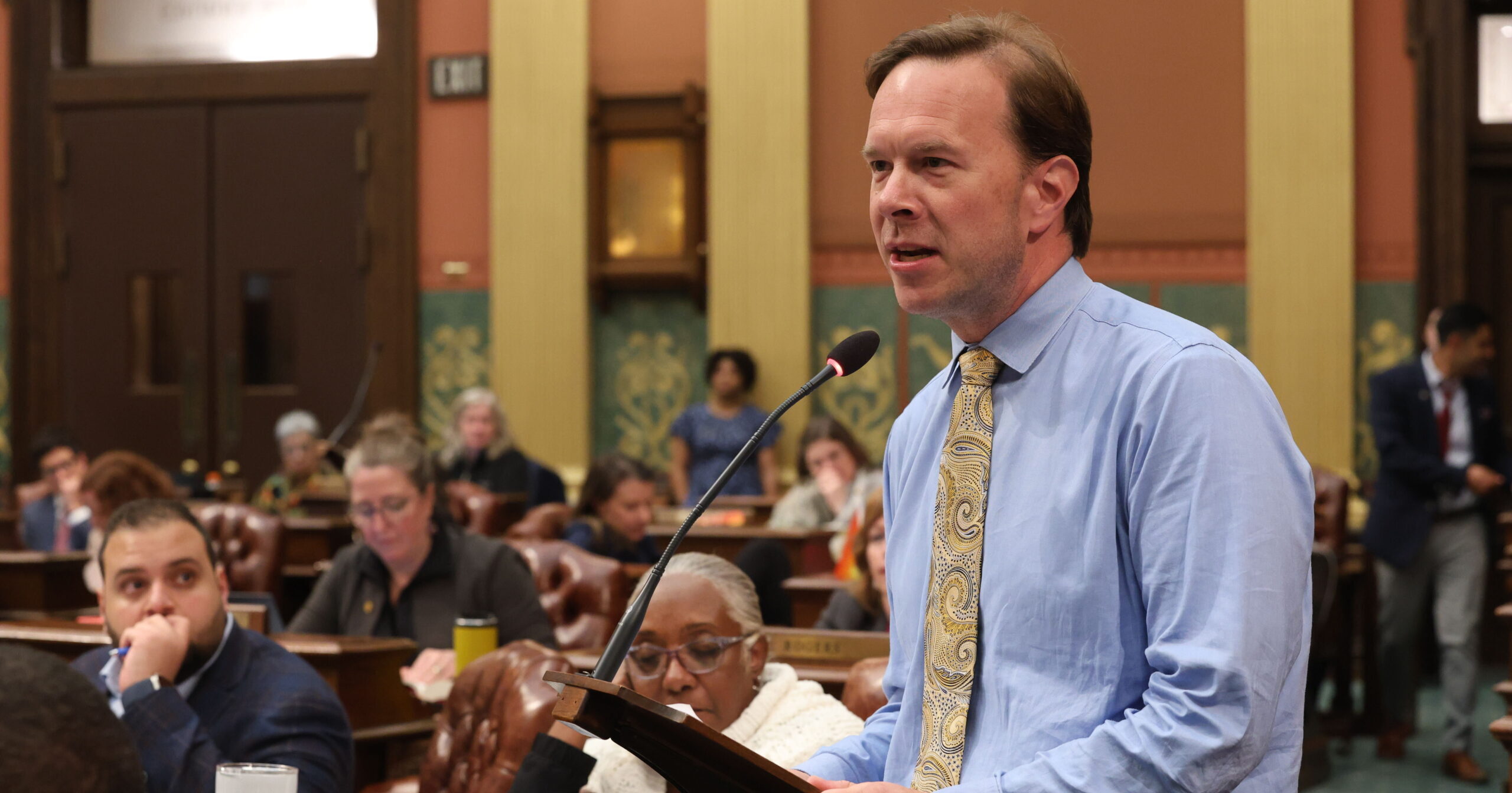 Michigan State Representative Matt Koleszar delivers a floor speech in support of Senate Bill 911 on the House Floor in the Michigan Capitol Building.