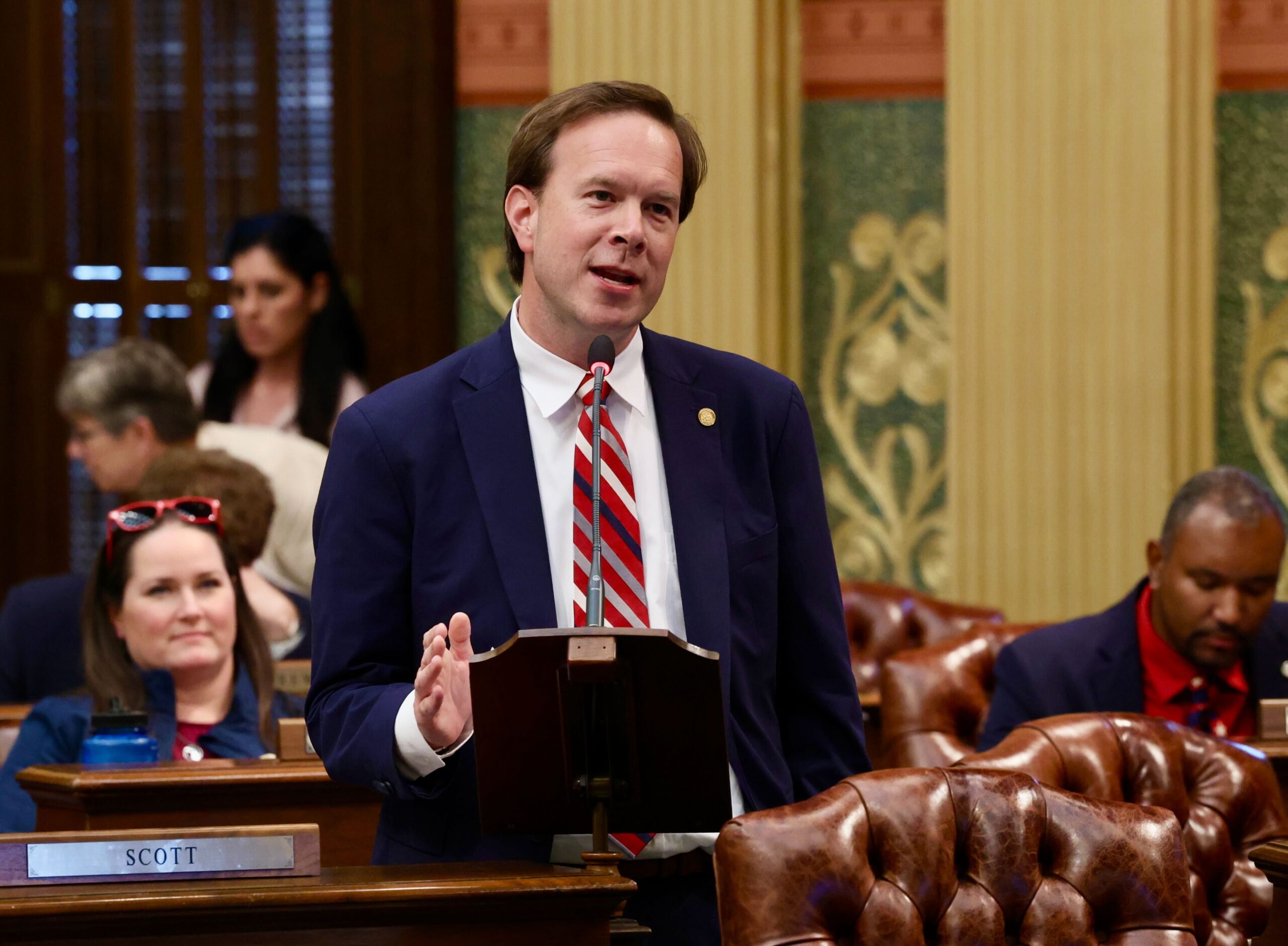 Michigan state Representative Matt Koleszar speaks on the House Floor in the State Capitol Building.