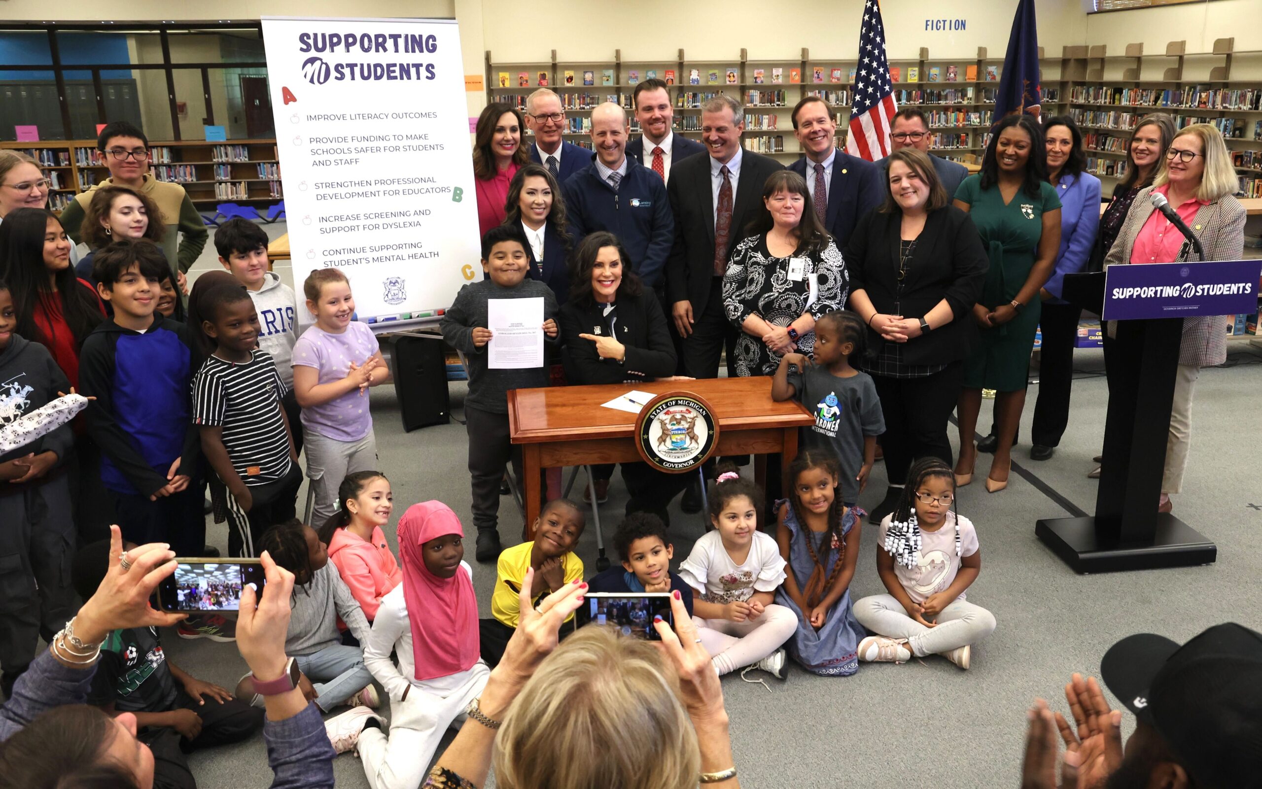 Lawmakers including State Rep. Regina Weiss (D-Oak Park), pictured with Gov. Whitmer for education bill signing, Oct. 10, 2024.