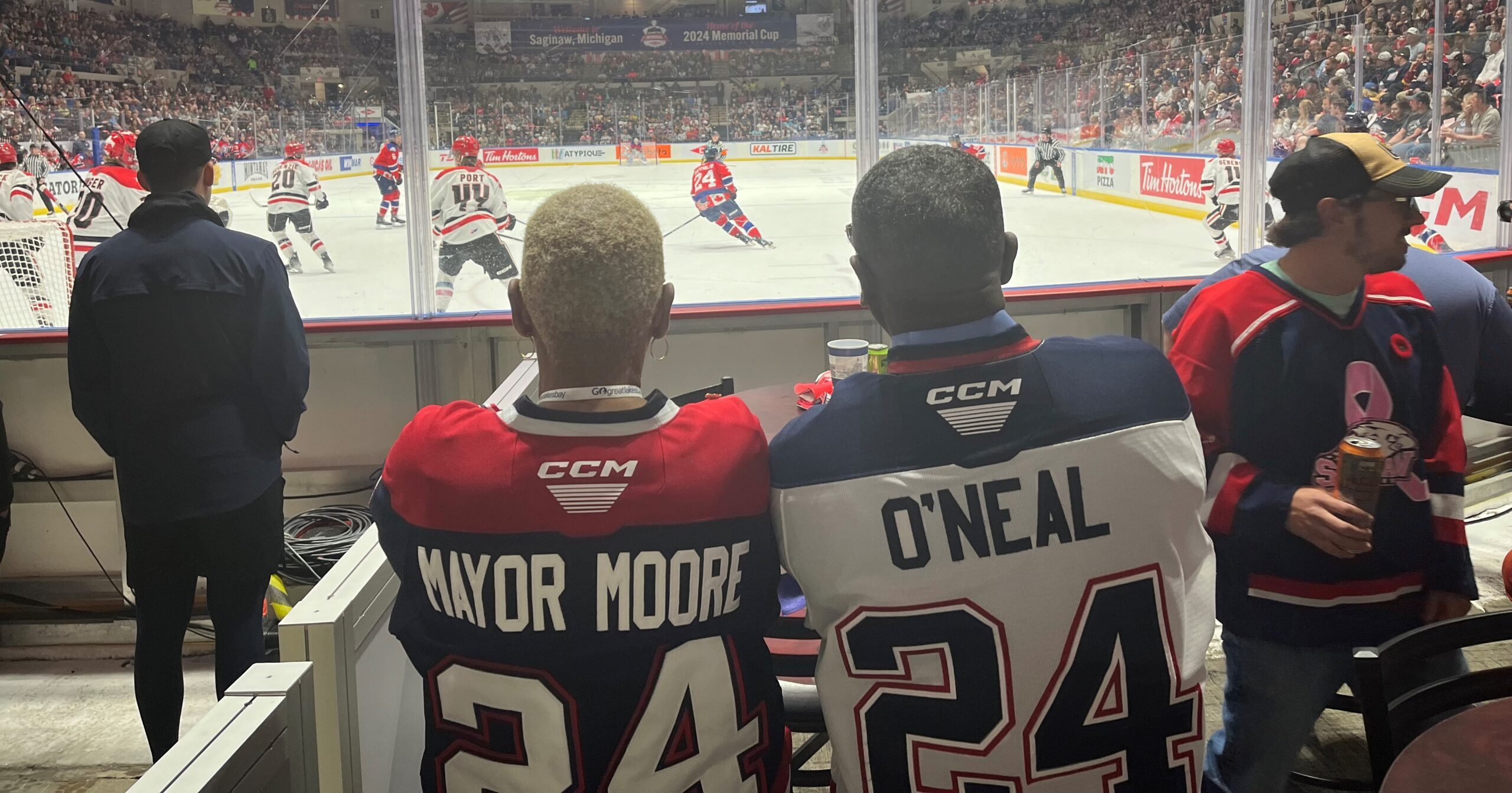 Saginaw Mayor Moorse and Michigan State Representative Amos O'Neal sit watching the final Memorial Cup game.