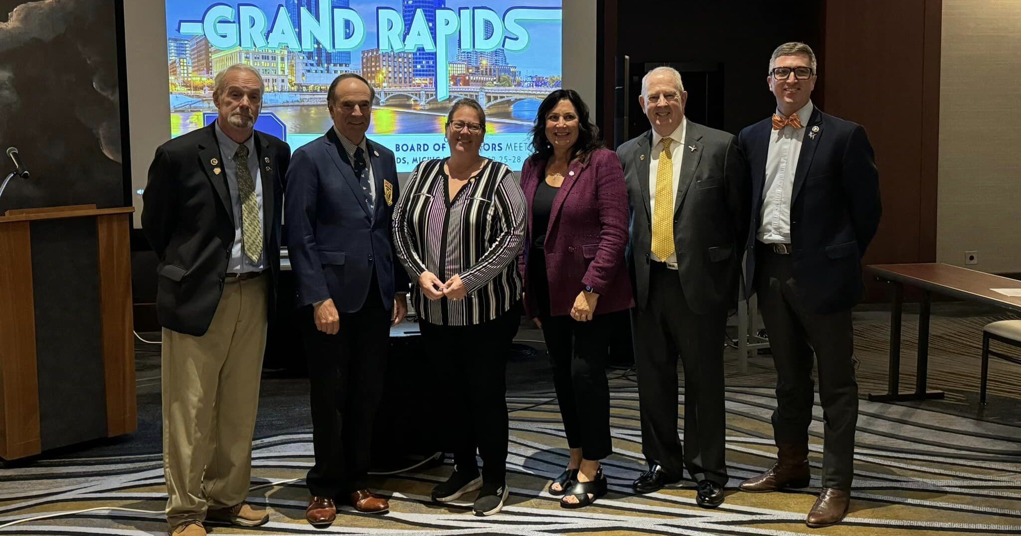 Michigan state Representative Angela Witwer stands with representatives from Ducks Unlimited to accept their Co-Legislator of the Year award.