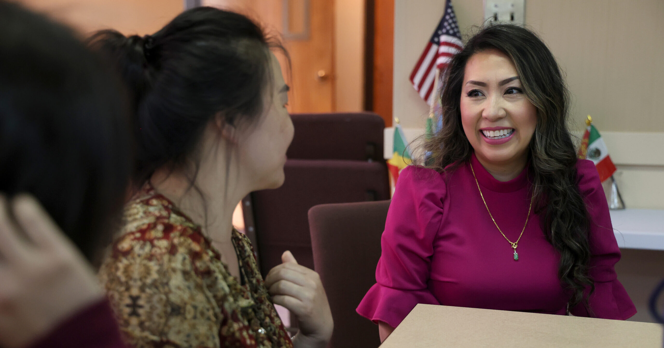 State Representative Mai Xiong smiles as she speaks with students in her district.