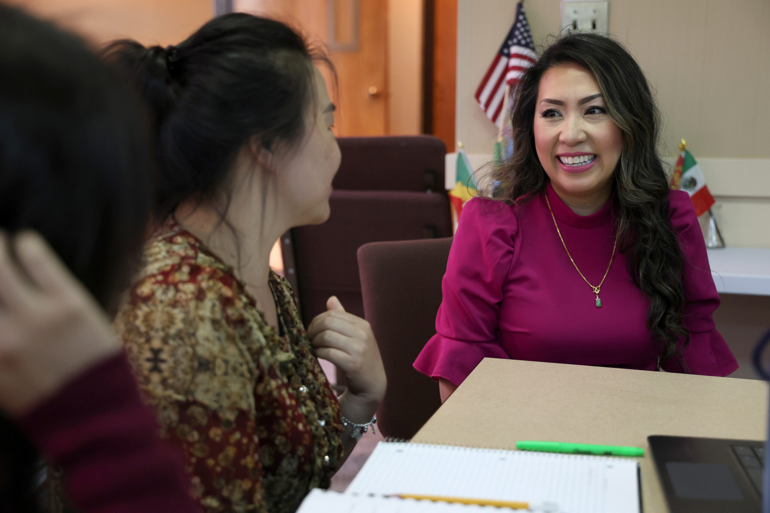 State Representative Mai Xiong smiles as she speaks with students in her district.