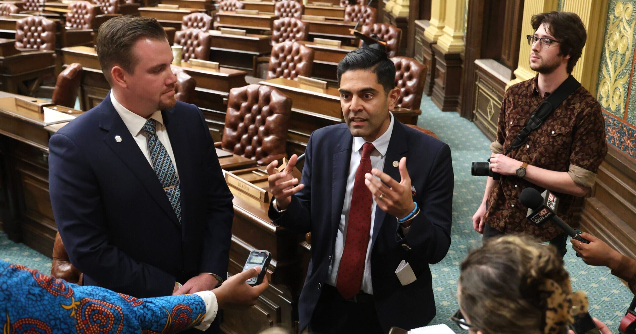 Floor Leader-elect john Fitzgerald and Minority Leader-elect Ranjeev Puri (D-Canton) speaking with journalist on the House Floor.