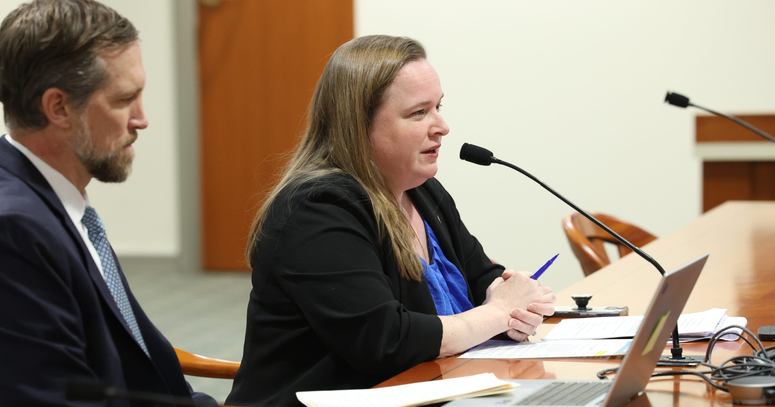 Michigan State Representative Kelly Breen sitting next to a colleague in the House Judiciary Committee.