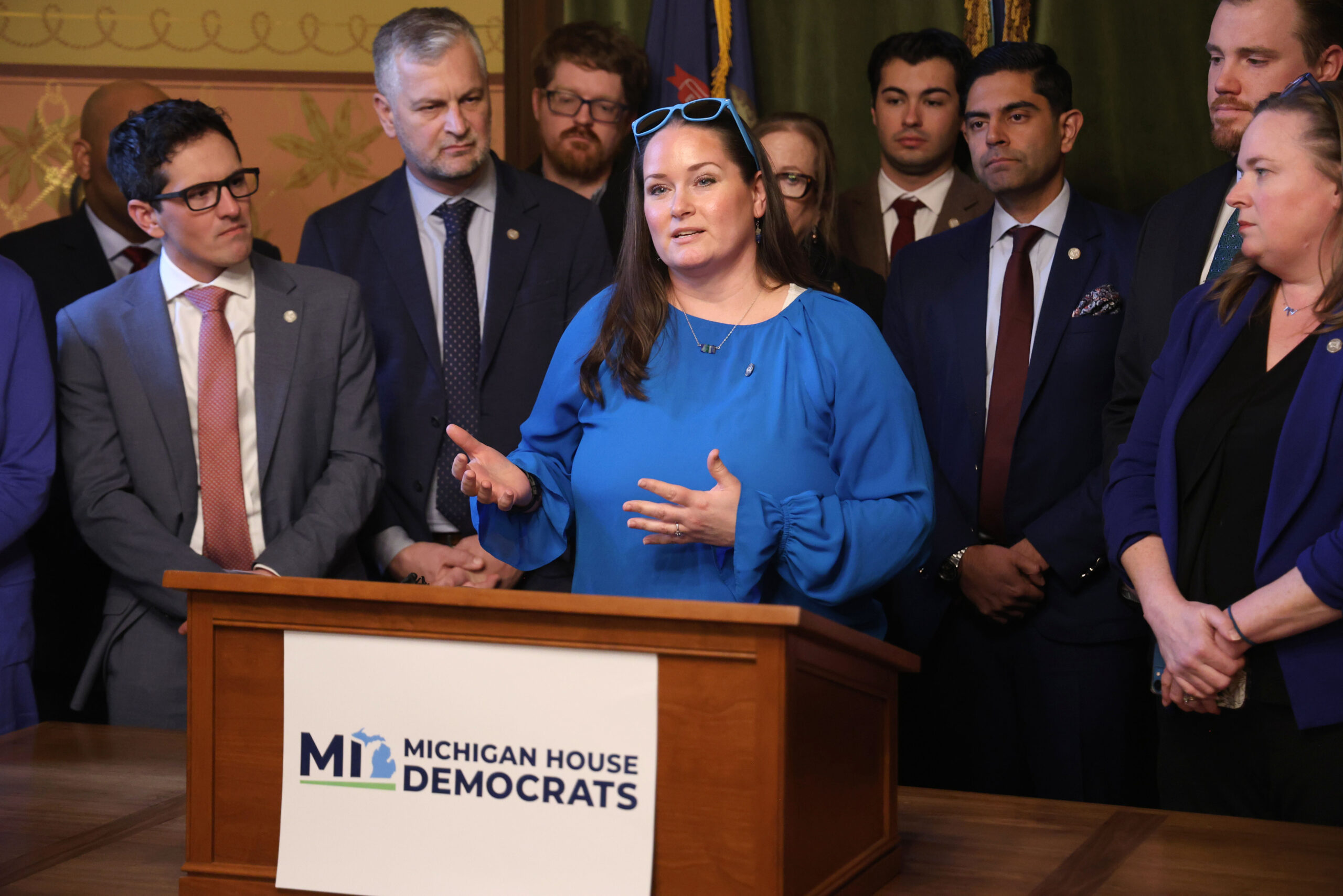 State Rep. Carrie A. Rheingans speaks at a press conference with other Democratic representatives.