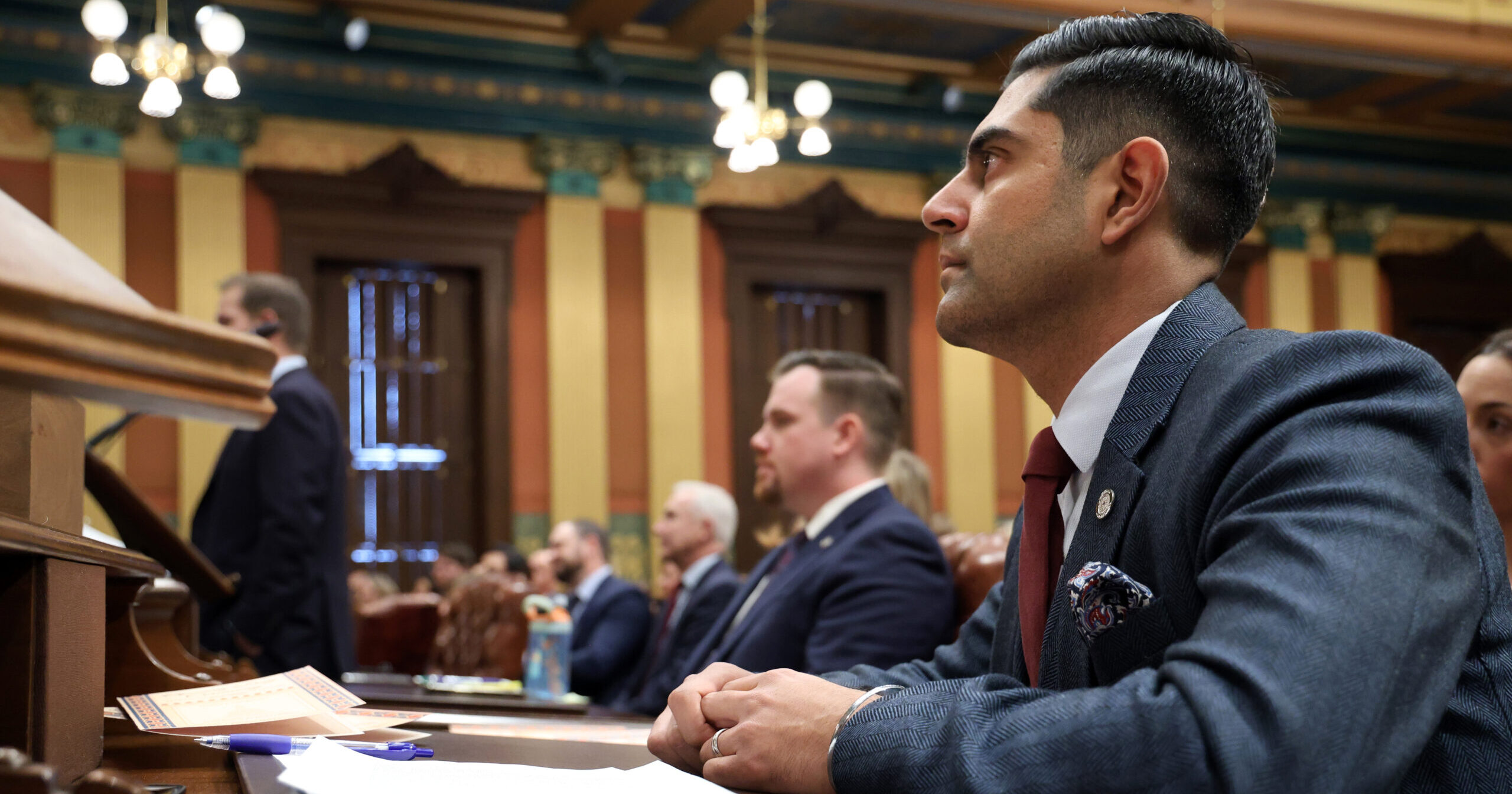 Michigan Democratic Leader sits at his desk on the House floor.