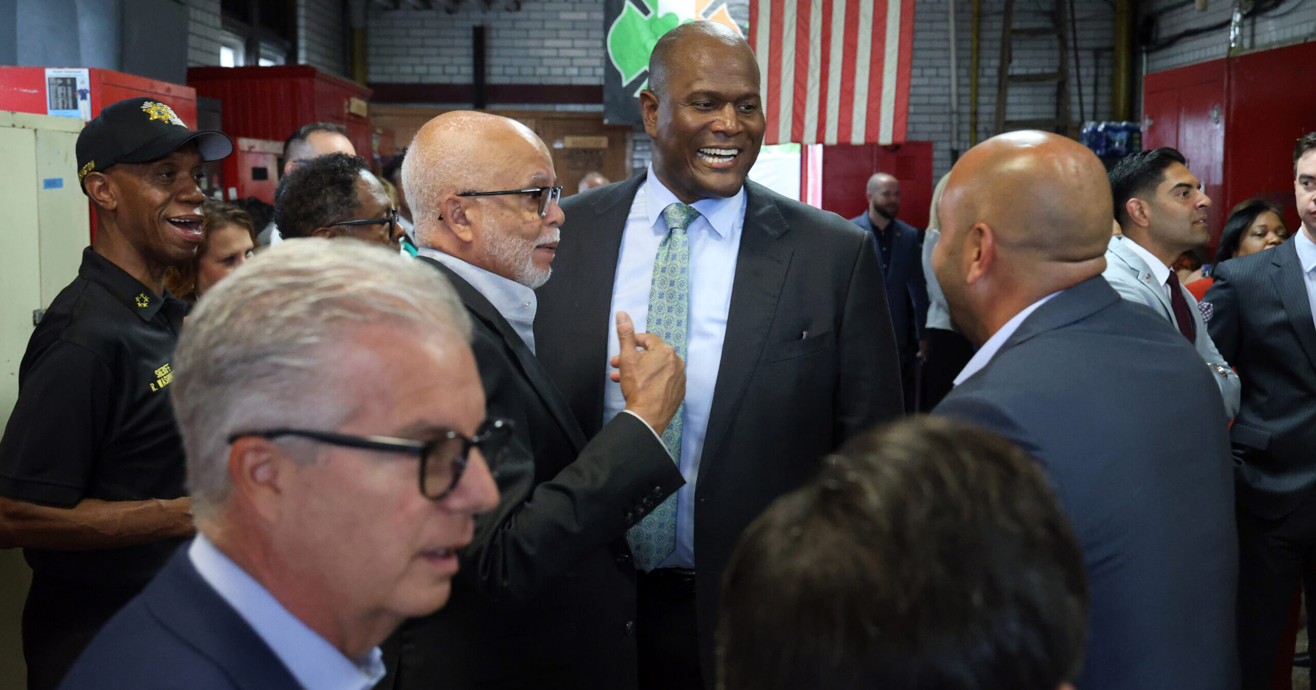 Michigan State Rep. Joe Tate at an event surrounded by guests.