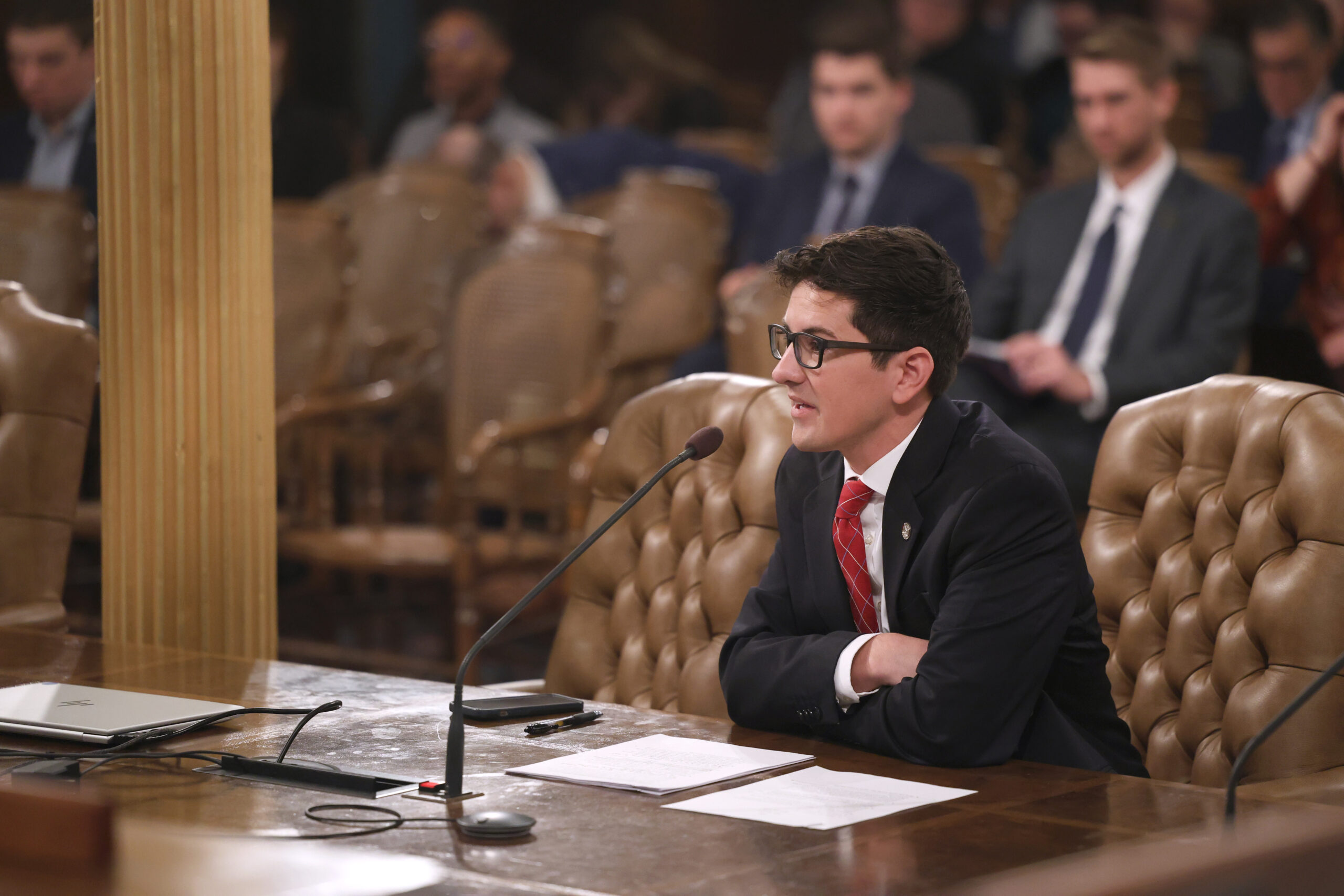 State Rep. Jason Morgan testifying in a committee.